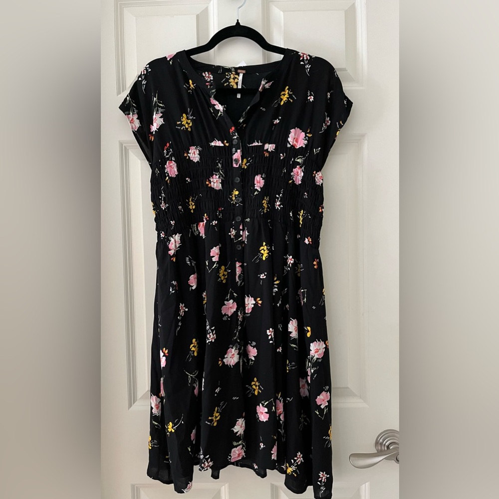 Free People Greatest Day Smocked Mini Dress
Black Floral, cap sleeves size L